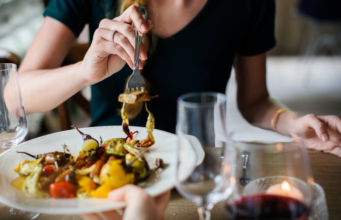 WOMAN EATING FOOD RESTURANT